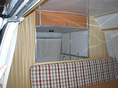 Bedroom with cabinets and sofa in a motorhome